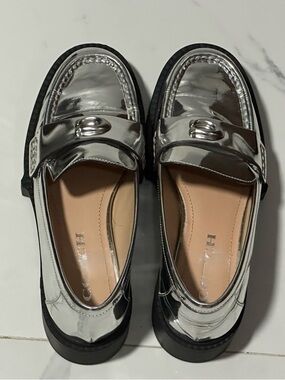 Coach Metallic Silver Women’s Penny Loafers, size 6.